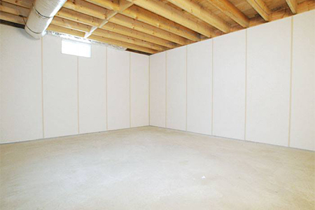 an interior space of a basement with waterproofing features